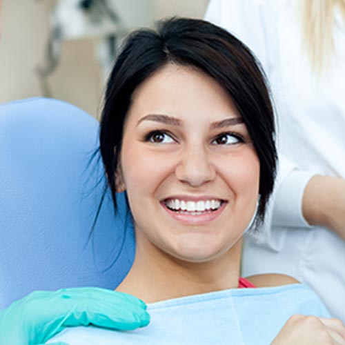 dental night guard in Brampton recommended for smiling woman at dentist