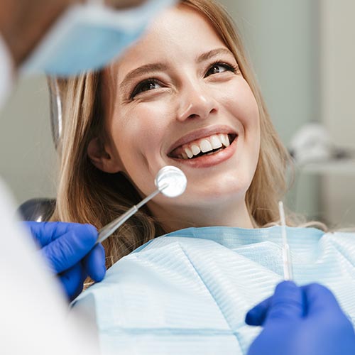 women at the dentist undergoing a dental exam in Brampton