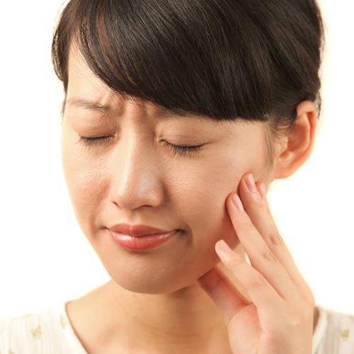 Wisdom teeth removal in Brampton recommended for woman with teeth pain