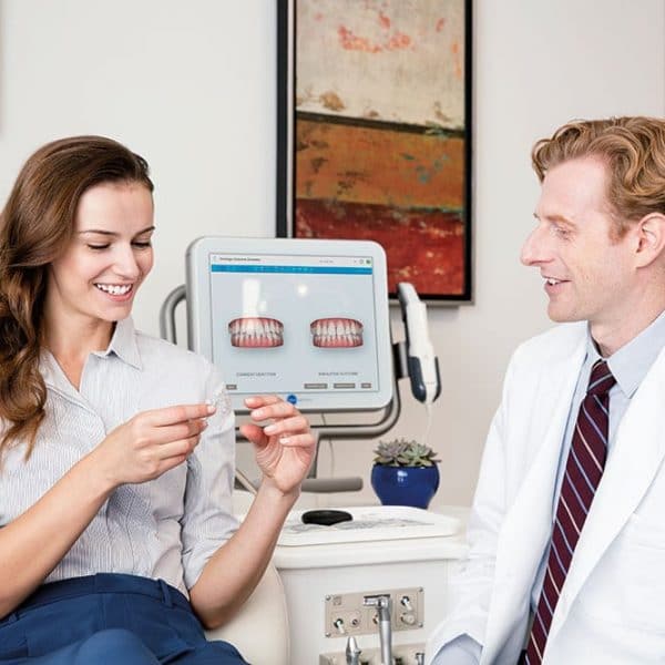 Dentist and patient discussing Invisalign in Brampton