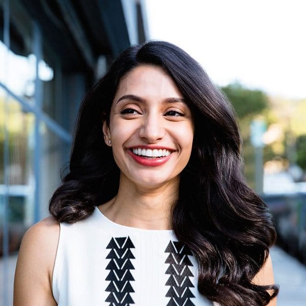 Lady smiling after completing Invisalign treatment in Brampton