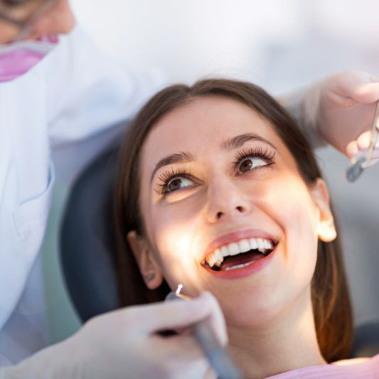 dentist and patient discussing dental inlays and onlays in Brampton
